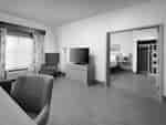 King Suite with Work Desk, Lounge Area, Room Technology, Bed, and Closet