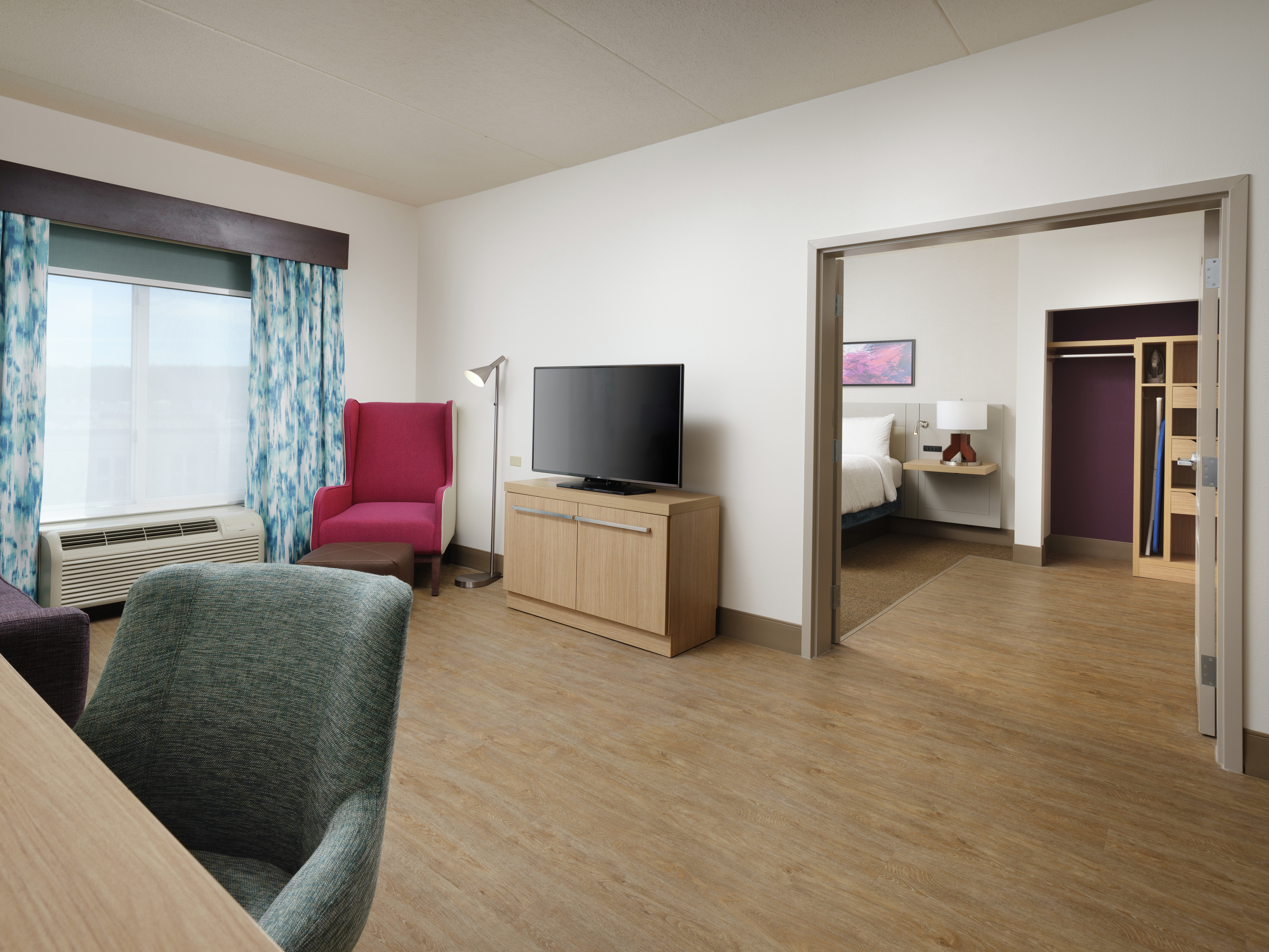 King Suite with Work Desk, Lounge Area, Room Technology, Bed, and Closet