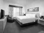 King Suite with Bed, Lounge Area, and Room Technology