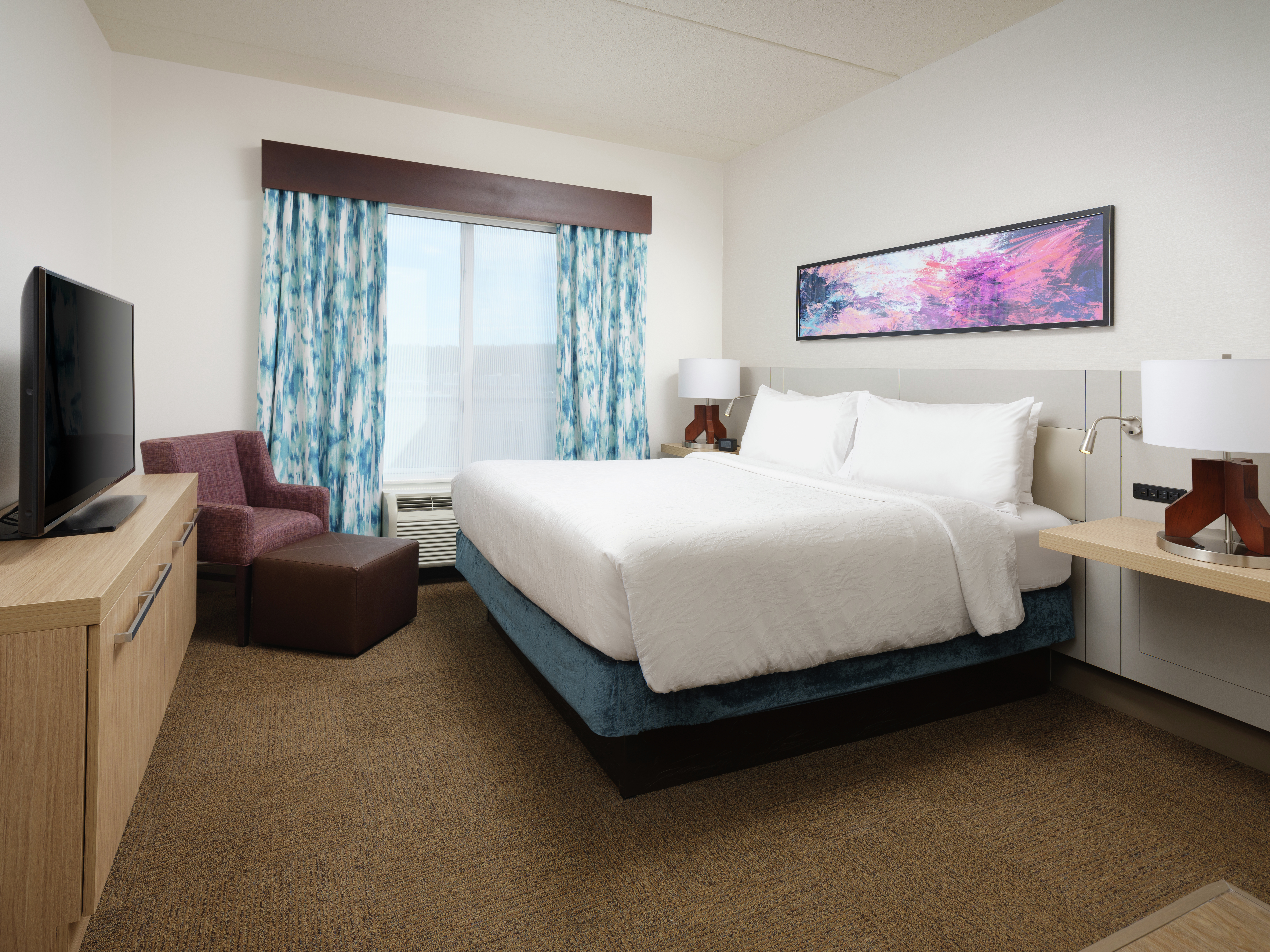 King Suite with Bed, Lounge Area, and Room Technology