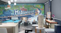 Lobby Game Area With Soft Seating, Game Tables,  Pool Table, and  Large McDonough Train Mural on the Wall