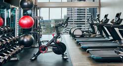 an exercise bike and weights in a fitness center