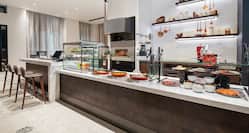 Artisanal Breakfast Area with Meat and Fruits on Counter
