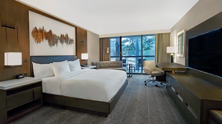 Bed in room with workdesk