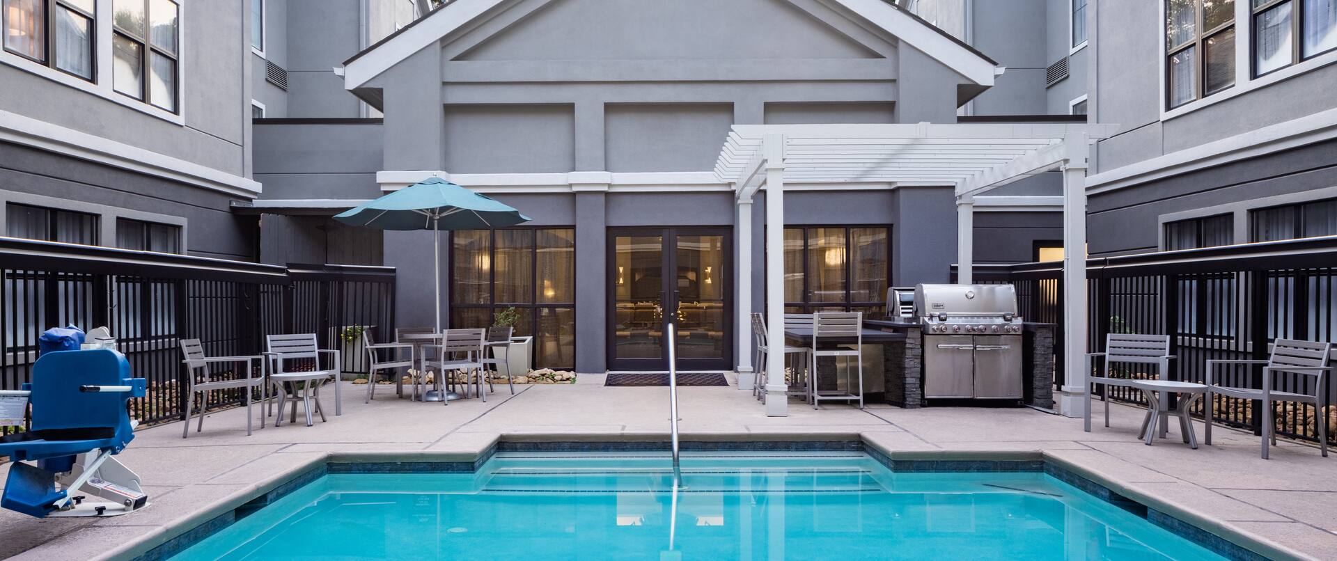 Outdoor Pool Area with Grills and Seating area
