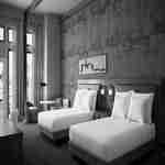 Guest room with two beds, small table and two chairs