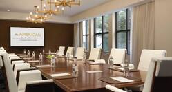 Meeting room in boardroom setup with Projector Screen