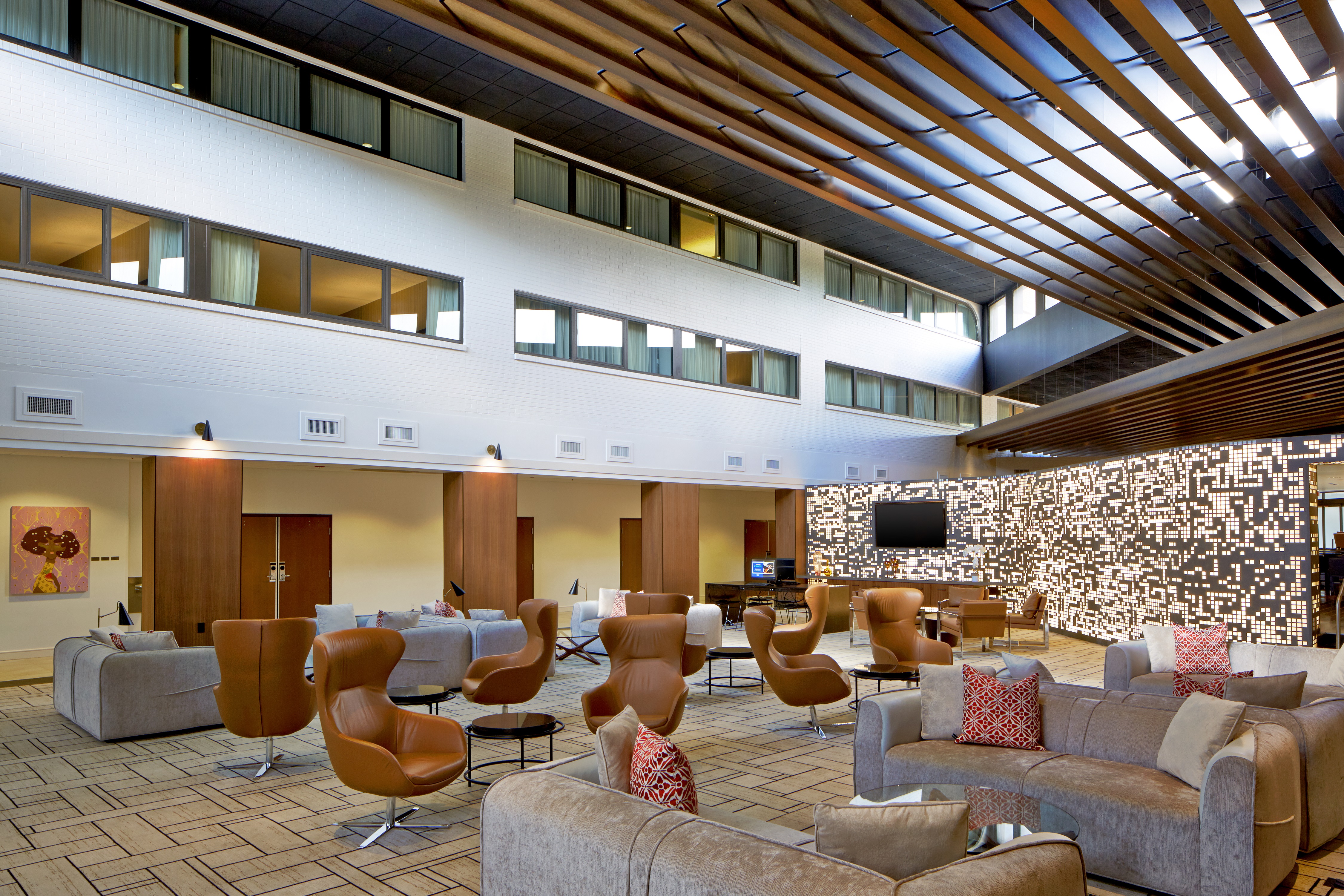Vast Atrium With Lounge Seating and View of Business Center