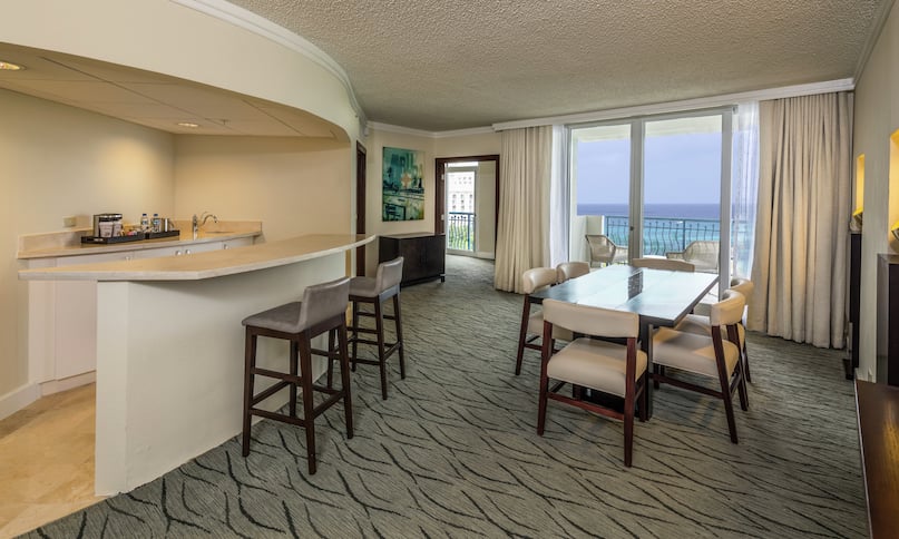 One King Bed Aruba Tower Ocean Front Suite Dining Area