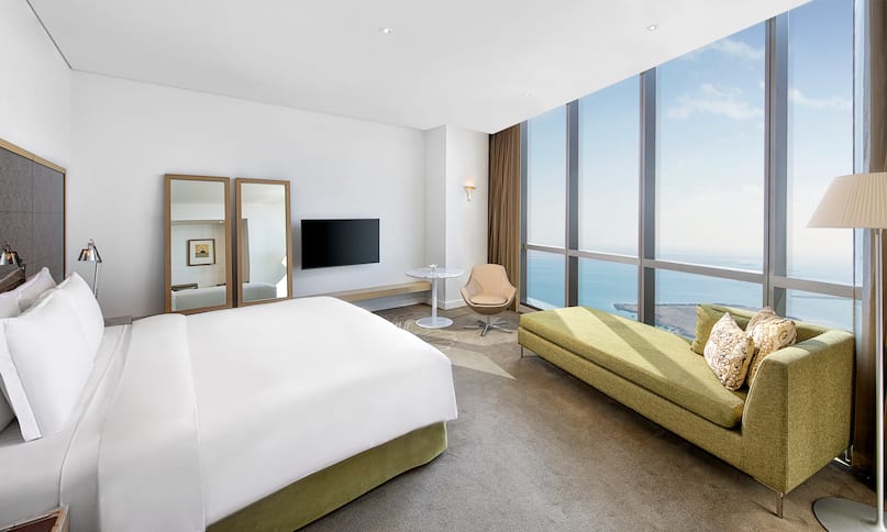 Guest Room with Large Bed HDTV and Sea View