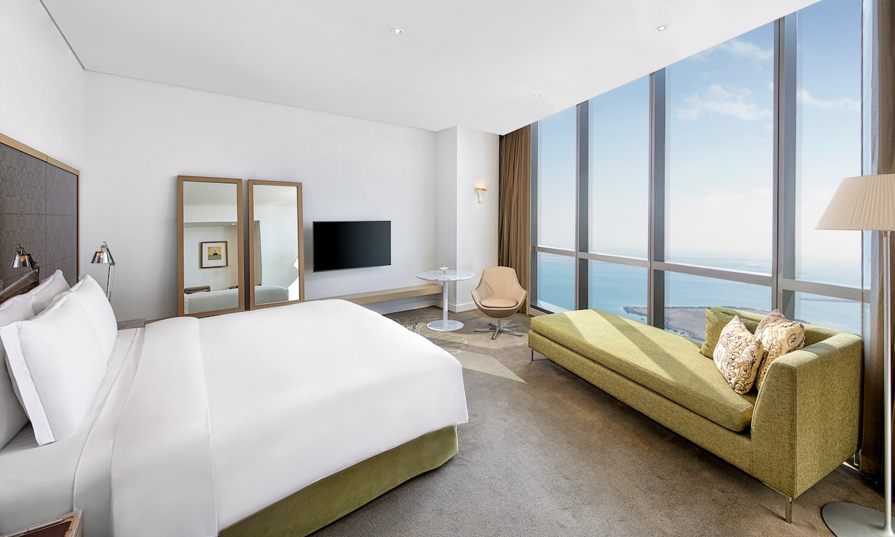 Guest Room with Large Bed HDTV and Sea View