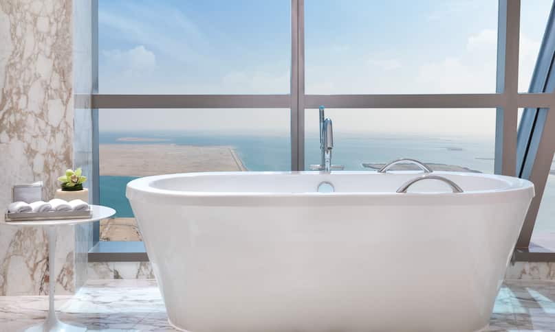Bathtub Next to Large Window of Sky Suite with Sea View-previous-transition