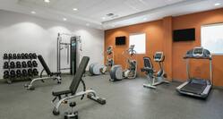 Fitness Center With Cardio Equipment, TVs, Windows, Weight Benches, Free Weights, and Weight Machines in Spin2Cycle Fitness Area