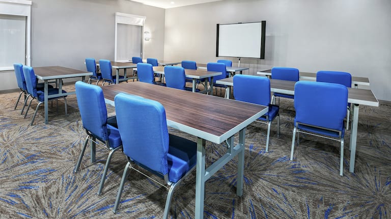 Meeting Room with Classroom Setup and Projector Screen