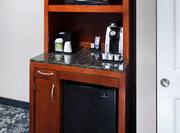 In Room Refreshment Center with microwave, coffeemaker, and small fridge.