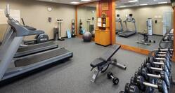 Hotel Fitness Center with treadmills, weights, and other equipment.