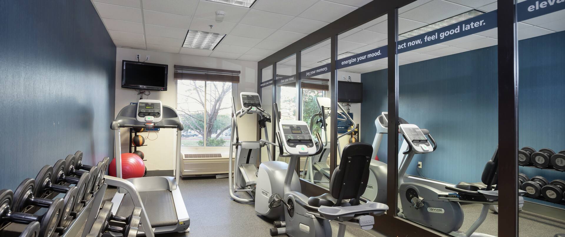 Fitness Center with Workout Equipment and Outside View