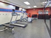 Workout Area with Cardio Machines and Weights