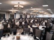 Spacious Ballroom Banquet Setup with Round Tables and Chairs