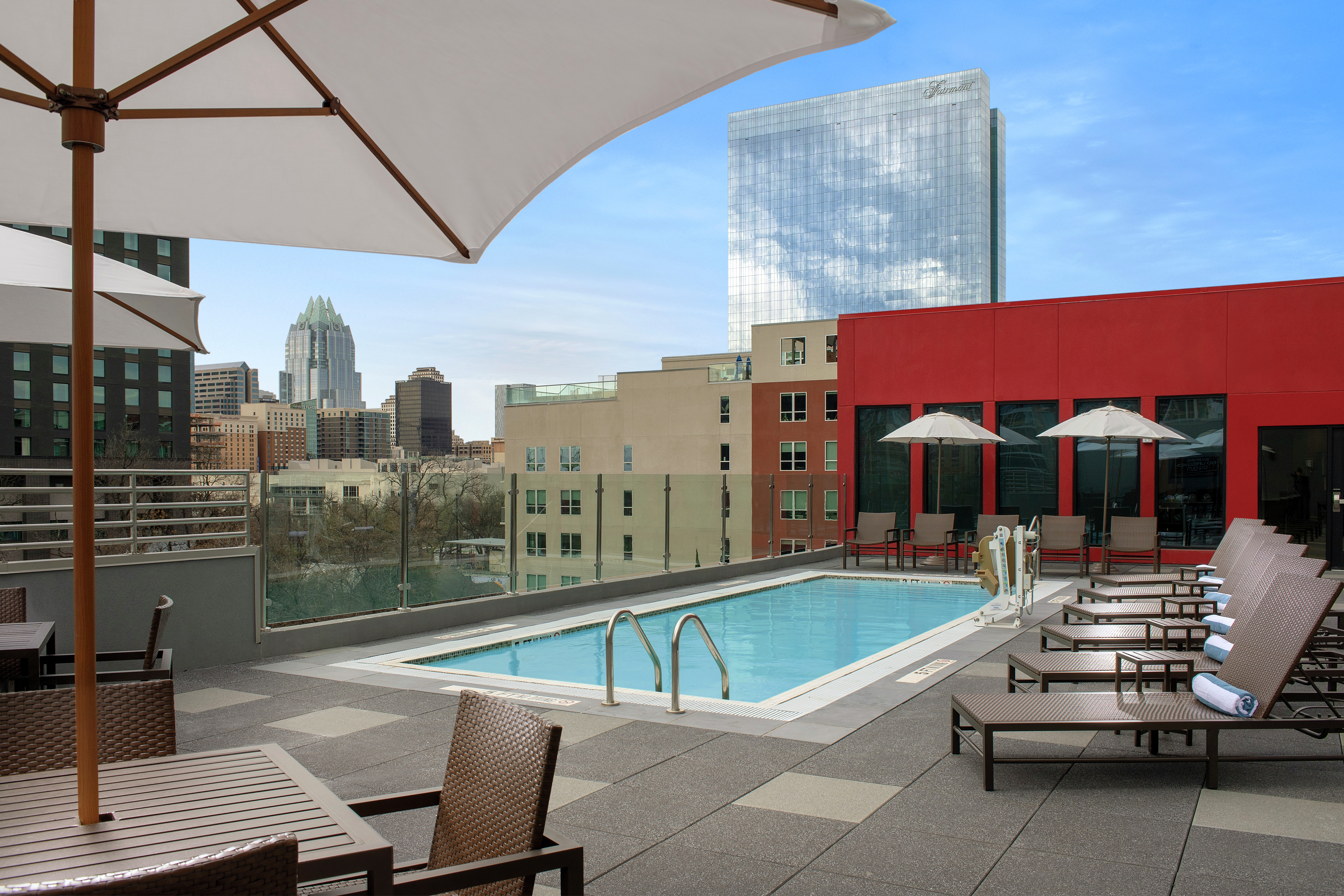 Outdoor Rooftop Pool and Lounge Area with City View