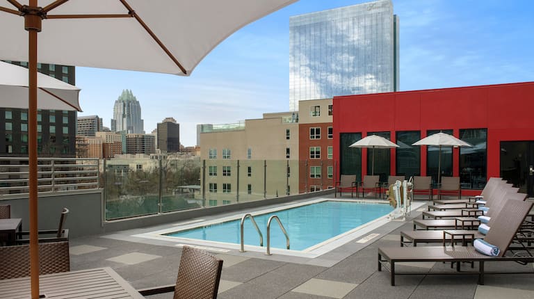 Outdoor Rooftop Pool and Lounge Area with City View