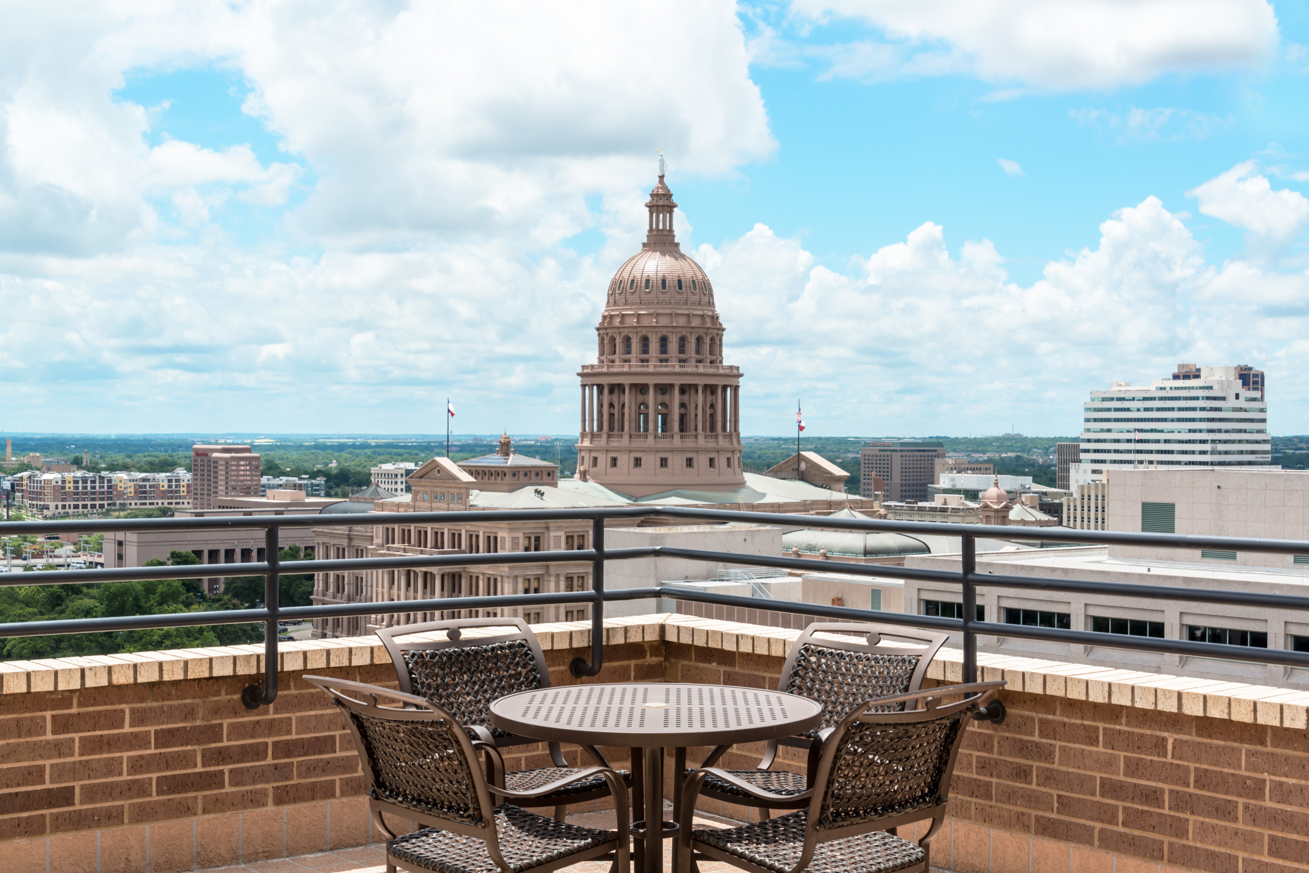 Daytime View of the Texas State Capital Building from Executive Suite Patio With Table and Four Chairs