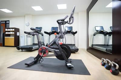 Fitness Center with Treadmills Weights and Exercise Bikes