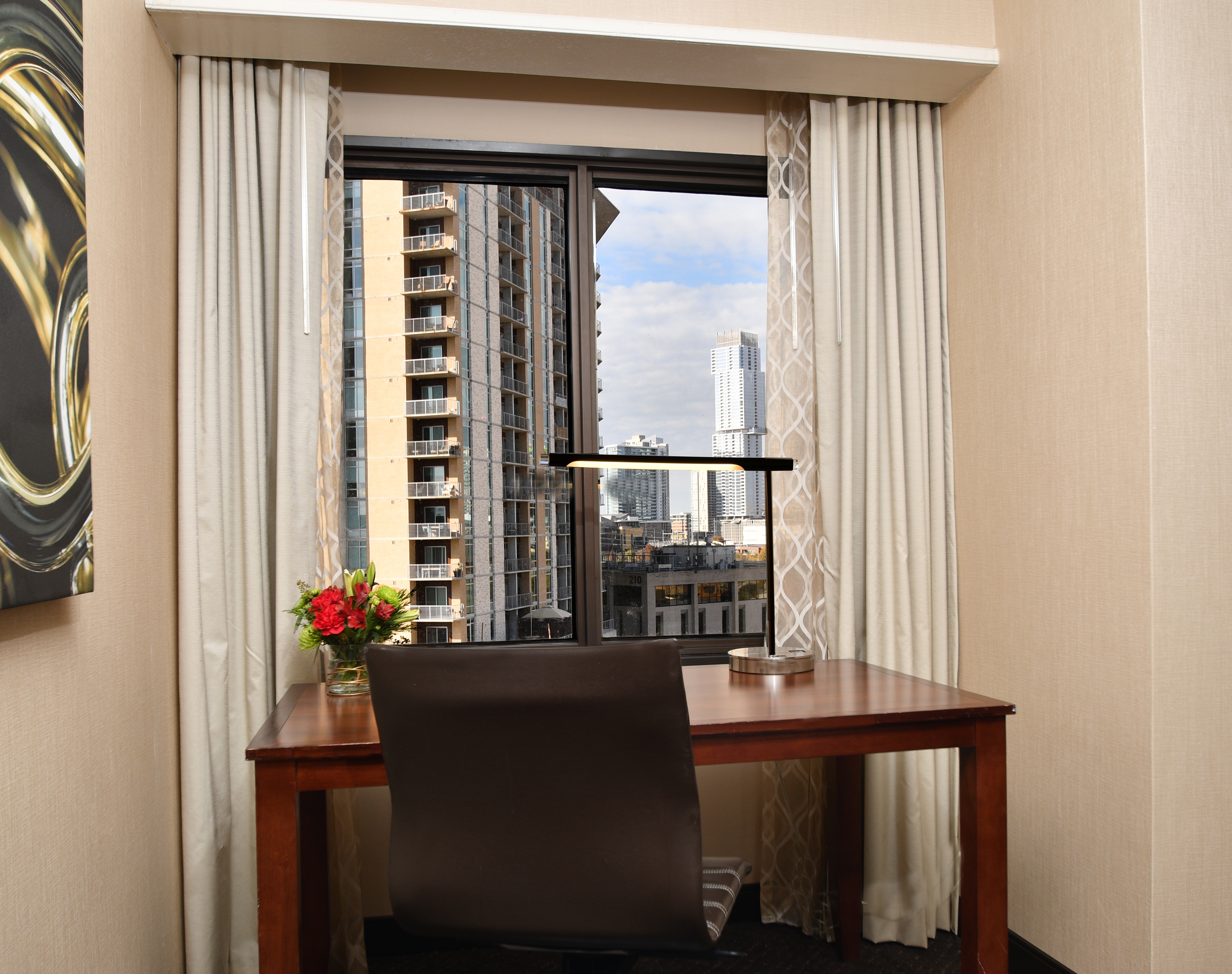 Desk in Front of Window with View of City
