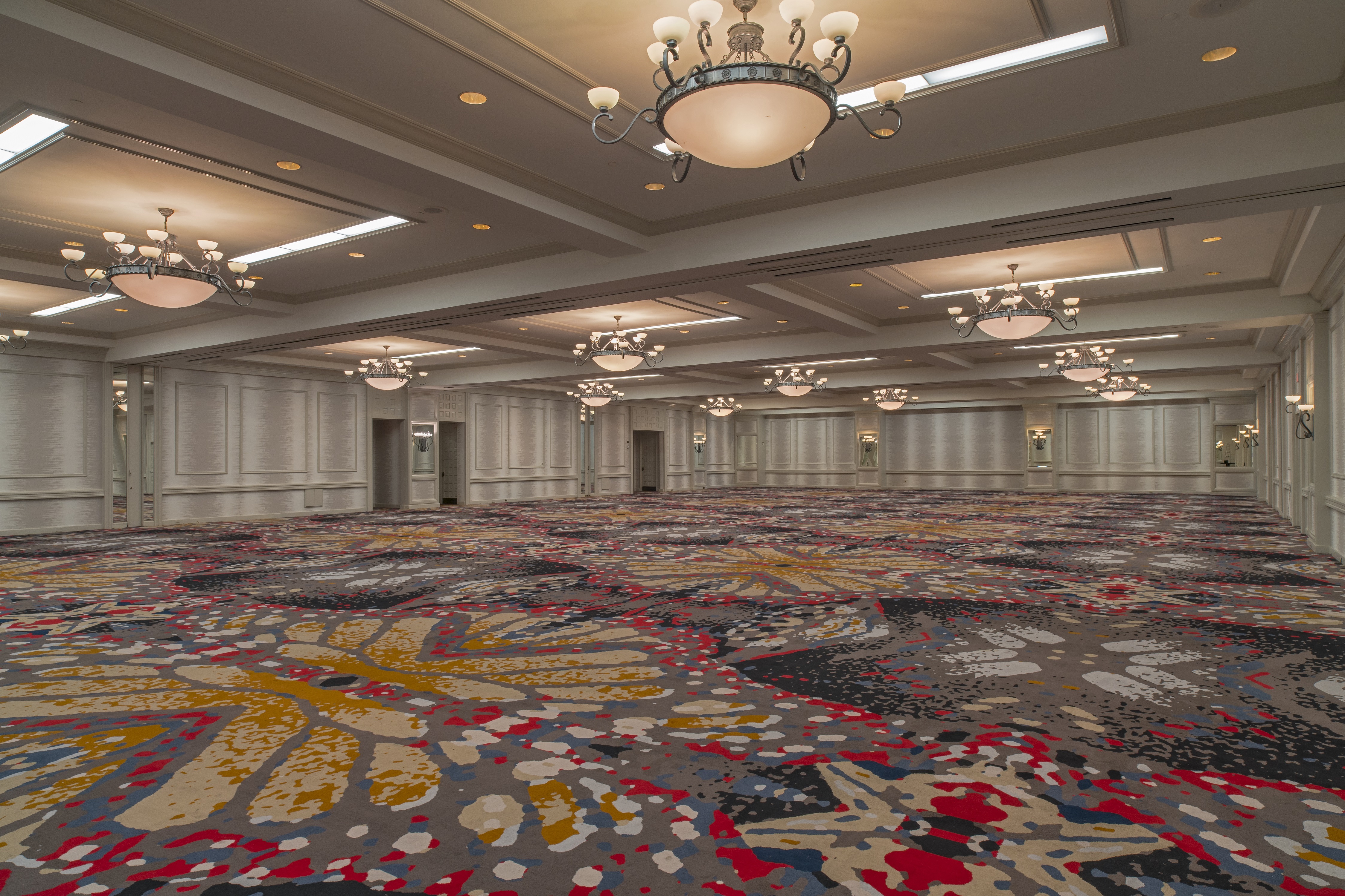 View of Phoenix Ballroom With Colorful Carpeting an Decorative Lighting