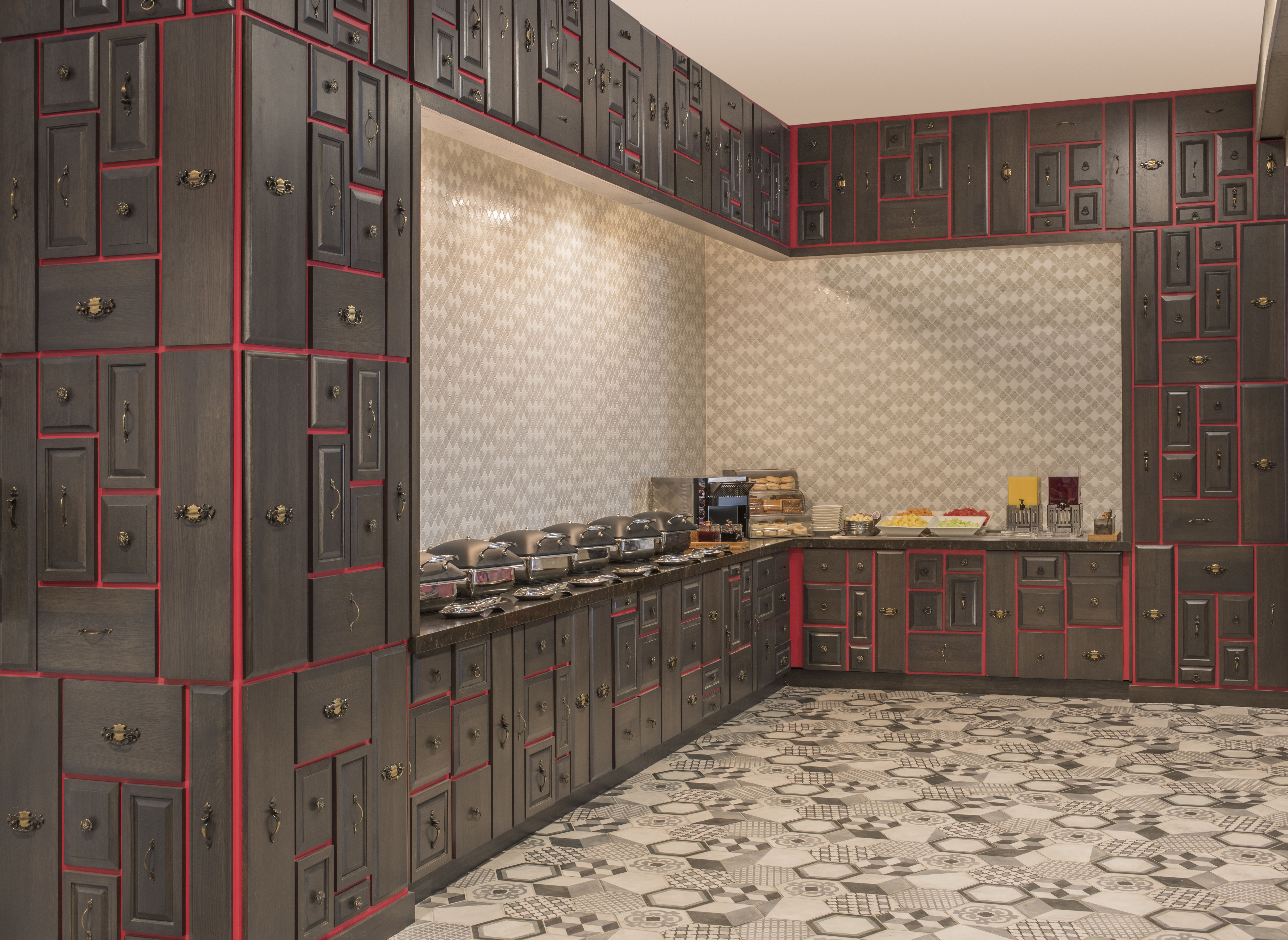 Wood Cabinets With Red Trim Surrounding Hot and Cold Breakfast Buffet in Texture Food & Drink