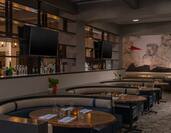 TVs Above Bar, Booth Seating, Round Tables, and Wall Mural at Texture Food & Drink