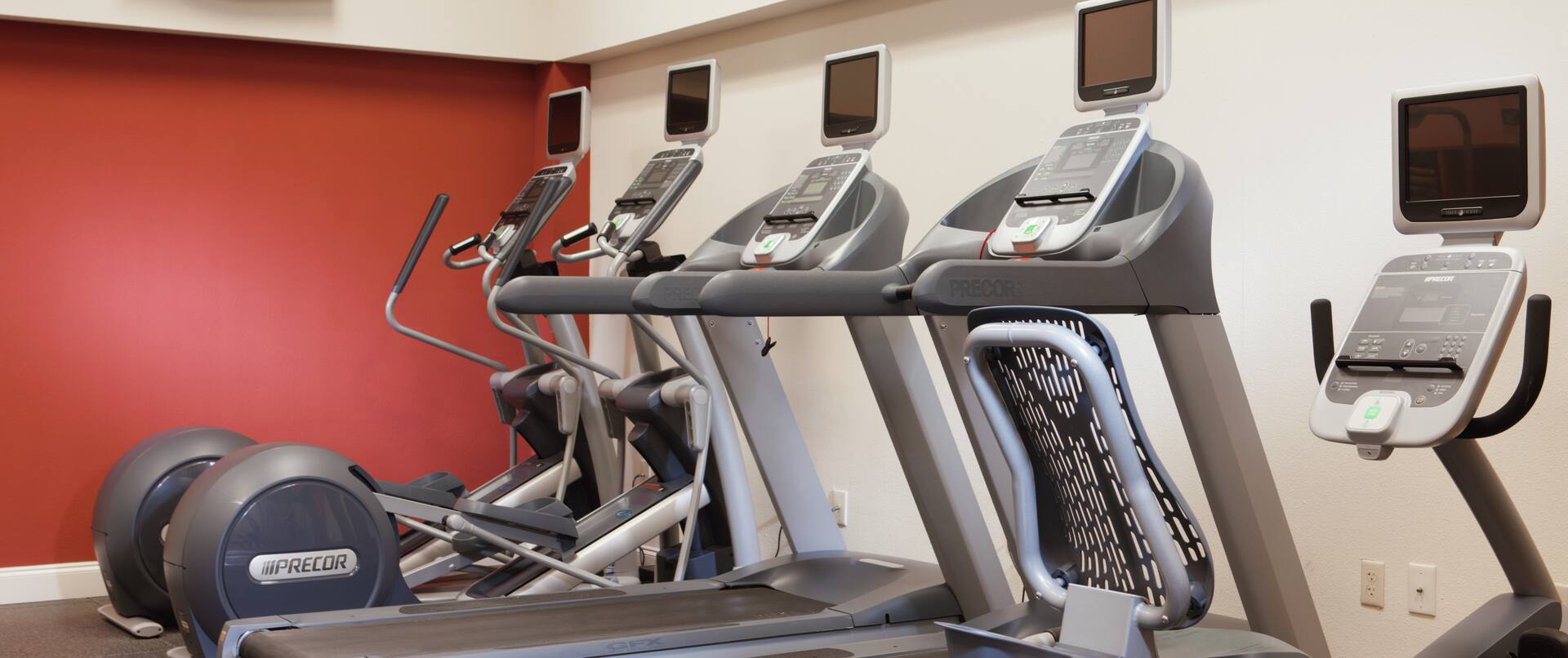 Fitness Center With TV and Cardio Machines