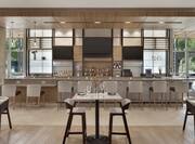Beautiful hotel bar featuring bright natural light, ample seating, and sophisticated design.
