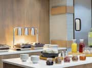 Complimentary breakfast buffet featuring delicious beverages and food.