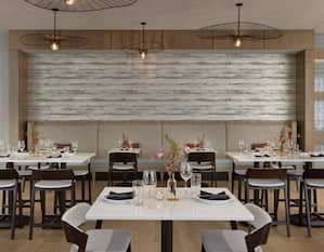 Stylish on-site hotel restaurant featuring thoughtful design, great atmosphere, and delicious food.