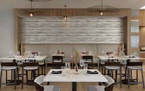 Stylish on-site hotel restaurant featuring thoughtful design, great atmosphere, and delicious food.