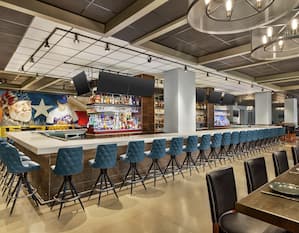 Wonderful on-site restaurant and bar featuring ample seating, large bar top, and eye-catching mural of local legends.