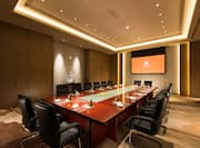 Seating for 16 Around Large Table and Presentation Screen in Boardroom