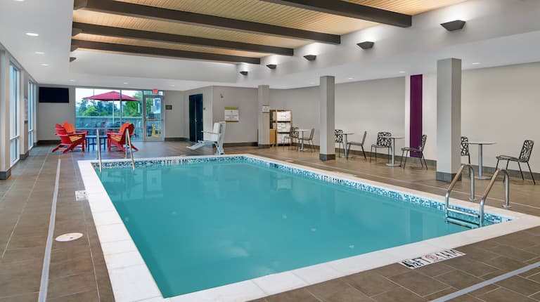 indoor swimming pool with seating around
