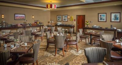 Ducker Tea Room With Dining Tables, Chairs, and Food Service Areas