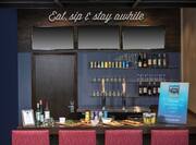 View of Bar Counter with Eat, sip & stay awhile sign above Counter
