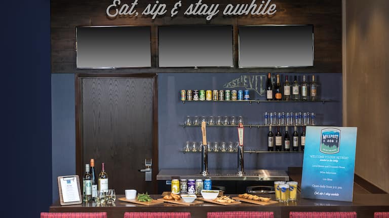 View of Bar Counter with Eat, sip & stay awhile sign above Counter