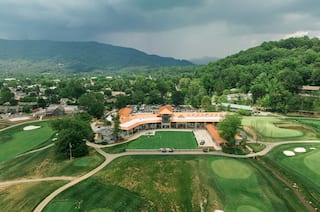Ariel view of the lush green lawn and the exterior of the inn.