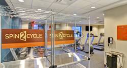 Spin 2 Cycle Towel Shelves with Fitness Center in Background