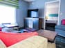 Guestroom Suite Lounge Area And Bedroom
