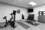 Fitness Room with Weights, Exercise Bike, Mats, Mirror and Television