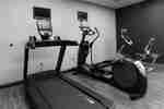 Treadmill and Recumbent Bike in a Fitness Center 