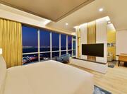 King bedroom of deluxe studio sea view with wall mounted TV