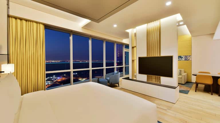 King bedroom of deluxe studio sea view with wall mounted TV