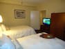 Guest Suite with Double Beds and Television